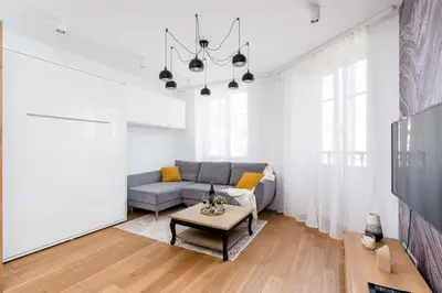 a living room with a couch and a table at Mieszkanie na Groblach in Kraków