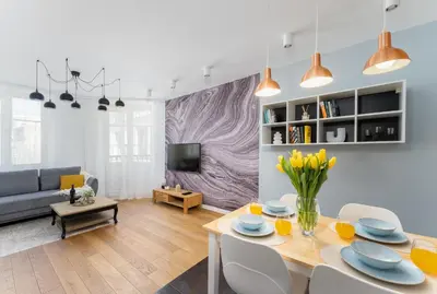a living room with a table and a couch at Mieszkanie na Groblach in Kraków