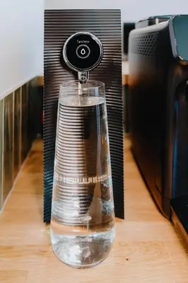 a bottle of water in front of a toaster at Tarlowska - Free Parking - Near Castle, Main Square & River - 3 bedroom, loggia, 2xTV 4K in Kraków