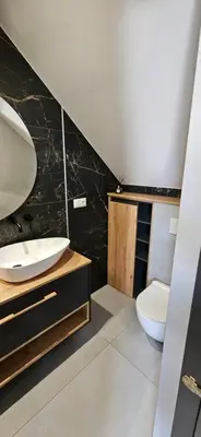 a bathroom with a sink and a toilet at Villa Kozikowka lake and forest near Krakow and Wieliczka in Ulesie