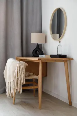 a wooden desk with a lamp and a mirror at Travelers Haven Spacious 70m2 2 Bedrooms Balcony Old Town Area in Kraków
