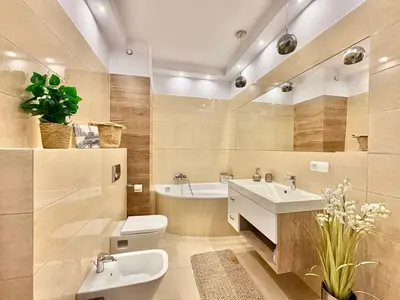 a bathroom with two sinks and a toilet and a tub at Lux 2bed, Wawel Castle, parking in Kraków