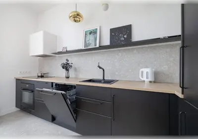 a kitchen with a sink and a counter top at Apartament Rodzinny w Centrum Krakowa by Noclegi Renters in Kraków