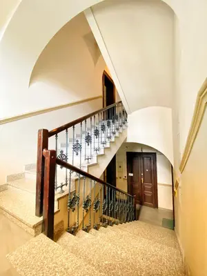 a staircase in a house with a circular stair case at Sky Mirror jacuzzi in Kraków