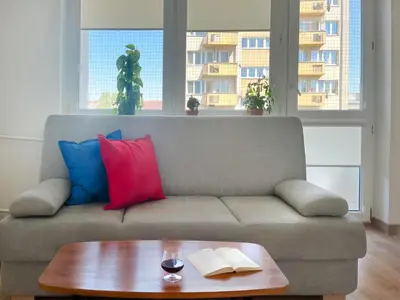 a living room with a couch and a coffee table at Apartment with private kitchen in the heart of Krakow, City Center in Kraków