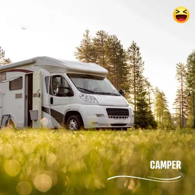 a white camper truck parked in a field at Kemping i Pole Namiotowe River Park Zator SPA RESORT in Zator