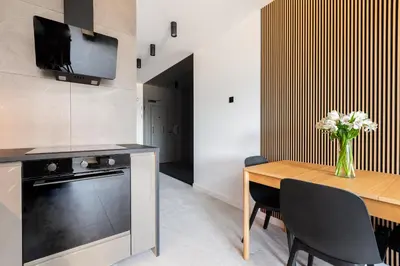 a lunch box with a sandwich and a plate of food at Native Apartments Długa 24I4 in Kraków