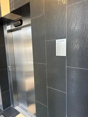 a kitchen with a stainless steel refrigerator in a room at Kaskada Apartment in Kraków