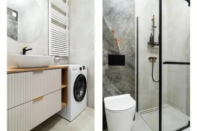 a bathroom with a sink and a washing machine at Househost Apartment Smoleńsk Elegant Studio AC Lift Security in Kraków