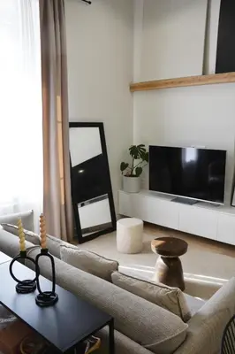 a living room with a couch and a tv at Stradom Studio in Kraków