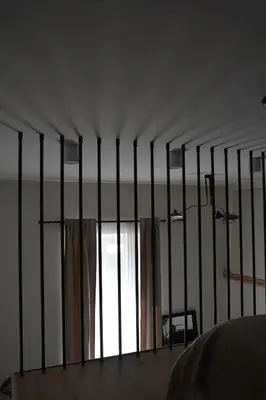 a room with a fence with a window at Stradom Studio in Kraków