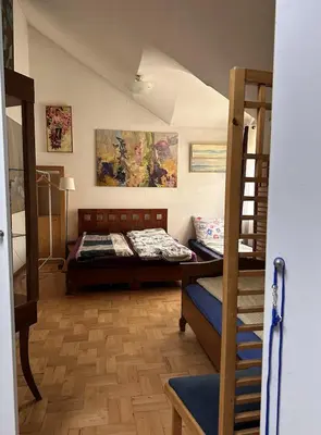 a bedroom with two bunk beds and a staircase at Villatopol in Rząska