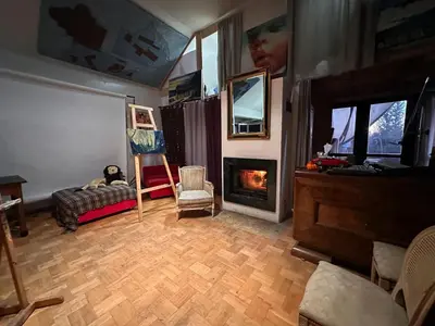 a living room with a couch and a fireplace at Villatopol in Rząska