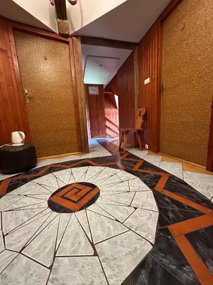 a room with a floor with an umbrella on it at Dom pod Cuplikiem in Zawoja