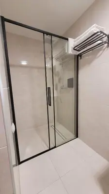 a shower with a glass door in a bathroom at Wiślana 4 in Spytkowice