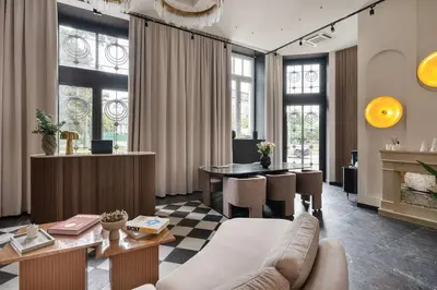 a living room with a couch and a table at So Soho Spa Collection in Kraków
