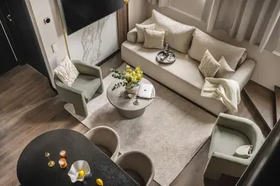 an overhead view of a living room with a couch and chairs at So Soho Spa Collection in Kraków