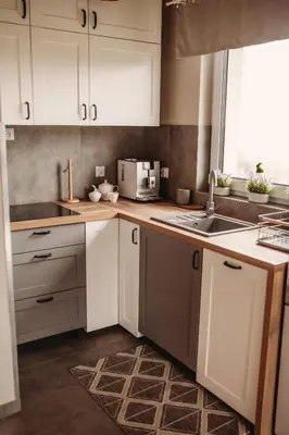 a kitchen with white cabinets and a sink at Beskidzka Kraina in Porąbka