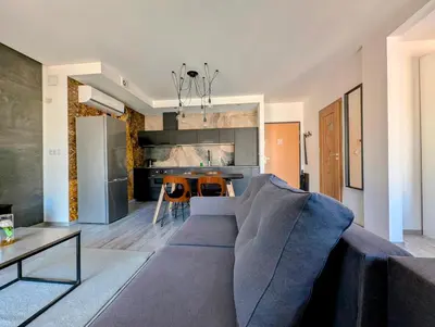 a living room with a couch and a table at Kościuszki 28 B by Homeprime in Kraków