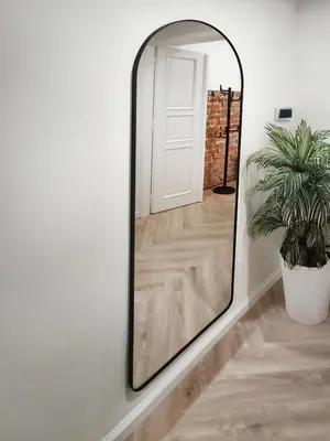 a large mirror on a wall with a plant at Studio Premium with Air Conditioning for couples in the heart of Krakow, Main Square in Kraków