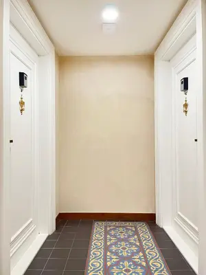 a hallway with two doors and a rug at Studio Premium with Air Conditioning for couples in the heart of Krakow, Main Square in Kraków