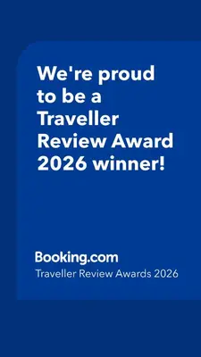 a blue sign that says were proud to be a traveller reviewagency winner at Celna Corner in Kraków