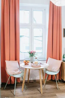 a dining room with a table and two chairs at Celna Corner in Kraków
