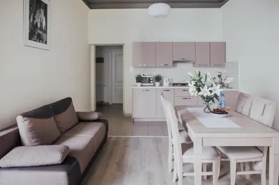 a living room with a couch and a table at Apartamenty Bonerowska 5 in Kraków