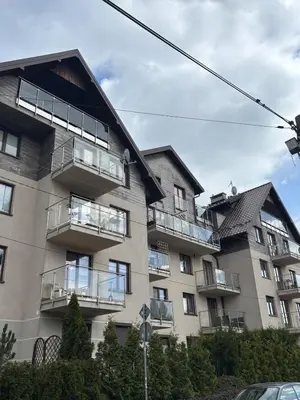 an apartment building with balconies on the side of it at Cozy Studio Apartment Krakow in Kraków
