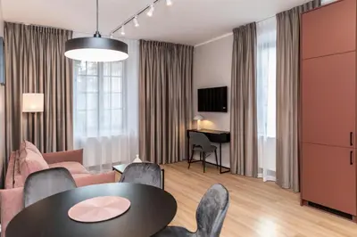 a living room with a table and chairs at Dom Pod Kotwicą in Kraków