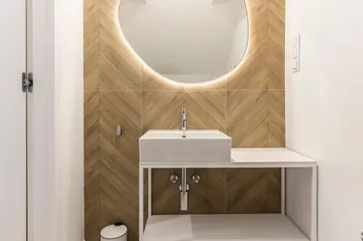 a bathroom with a white sink and a mirror at Dom Pod Kotwicą in Kraków