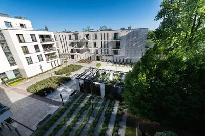 an overhead view of a park with a bench and buildings at Kościuszki apartment with parking by Nearto pl in Kraków