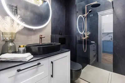 a bathroom with a sink and a shower at BoB Elite - Bonerowska in Kraków