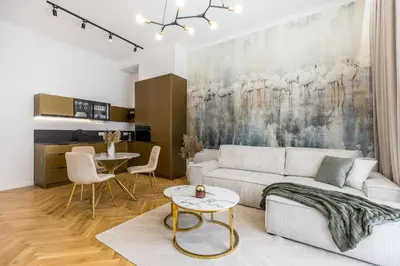 a living room with a couch and a table at BoB Elite - Bonerowska in Kraków