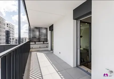 an apartment with a balcony with views of the city at Blue Blue Apartment in Kraków