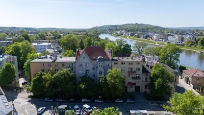 an aerial view of a large building next to a river at Malila Premium Apartments Cracow Rynek Dębnicki 8 in Kraków