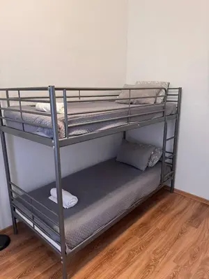 a metal bunk bed in a room at Enios Rooms Hostel Zwierzyniecka 6 in Kraków