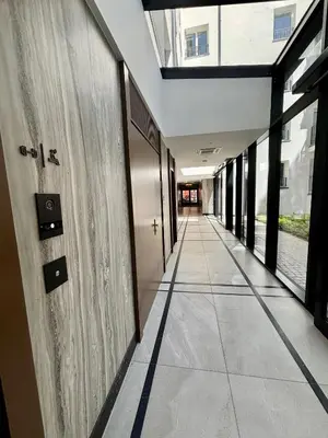an empty hallway of a building with a hallway at Old Town Libra Apartment in Kraków