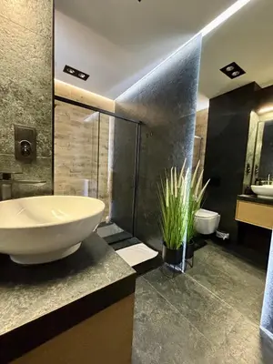 a bathroom with a large white sink and a toilet at Old Town Libra Apartment in Kraków