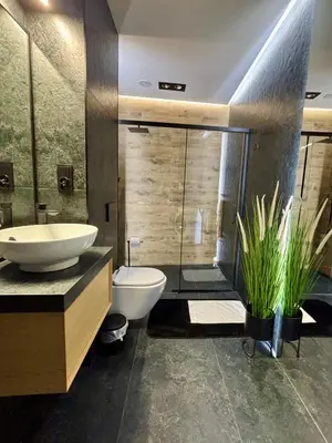 a bathroom with a sink and a toilet and a shower at Old Town Libra Apartment in Kraków