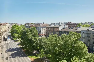 an aerial view of a city with buildings and trees at Słowackiego Avenue Cozy Stay Studio by BookingHost in Kraków