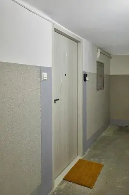 an empty room with a door and a hallway at Słowackiego Avenue Cozy Stay Studio by BookingHost in Kraków