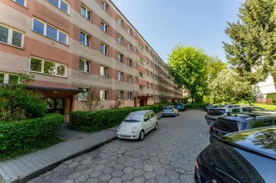 a car parked in front of a building at Grzegórzki Pleasant Apartment by BookingHost in Kraków