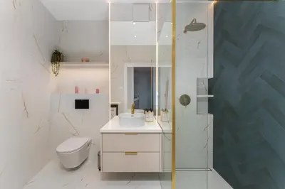 a bathroom with a toilet and a sink and a shower at Malila Premium Apartments Cracow Rakowicka 254 in Kraków