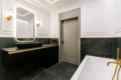 a bathroom with a sink and a mirror at Prestige Central Apartment with Sauna & Parking in Kraków