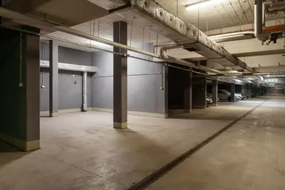 an empty parking lot in an empty parking garage at OSKA Apartment near Expo, Tauron Arena in Kraków