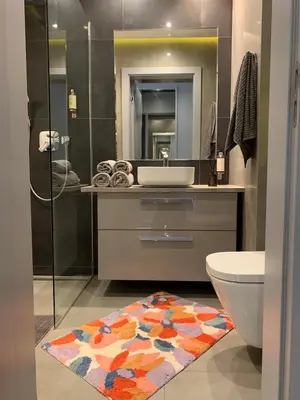 a bathroom with a sink and a toilet and a mirror at Rajska 3 in Kraków