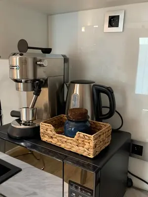 a counter with a coffee maker and a basket on it at Rajska 3 in Kraków