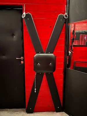a bedroom with a bed with a neon sign on it at Lust&Desire BDSM Krakow Apartment in Kraków