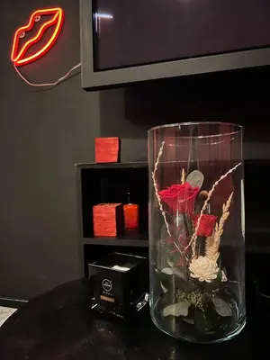 a red room with red chairs and a floor lamp at Lust&Desire BDSM Krakow Apartment in Kraków